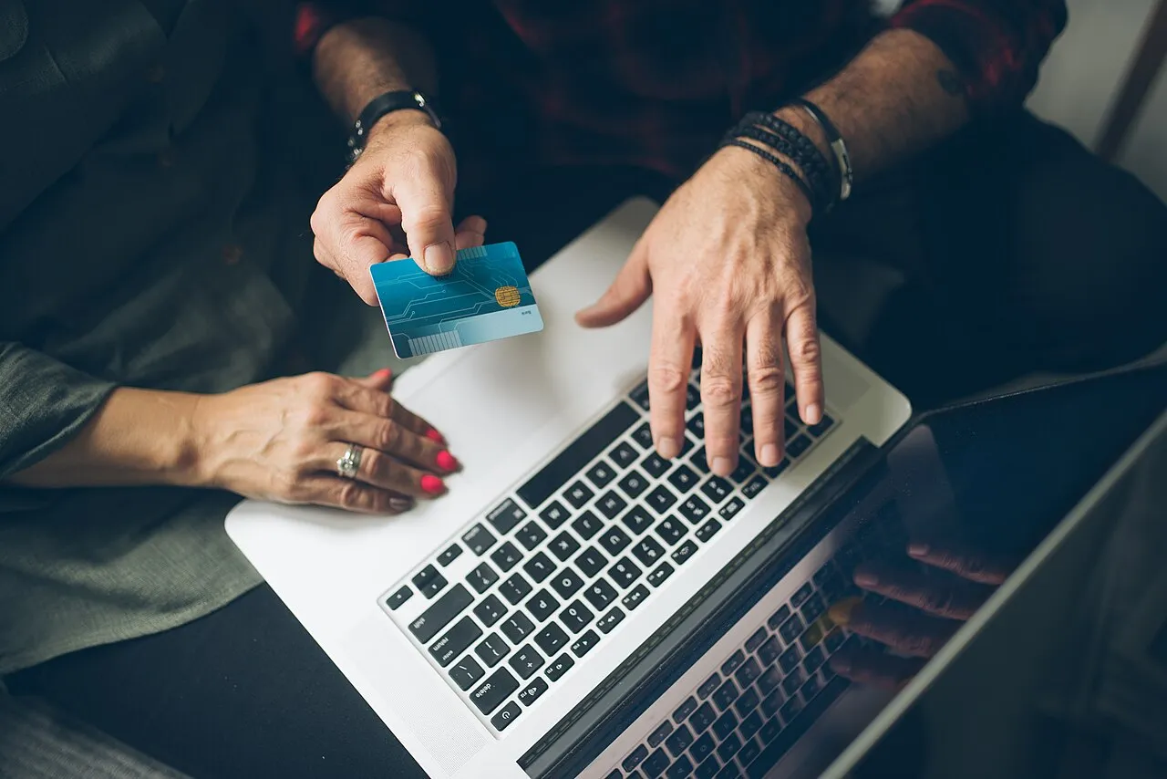 A couple reviewing finances together on a laptop